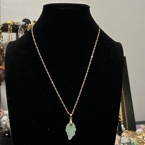 Gold Necklace with Leaf-Shaped Green Pendant